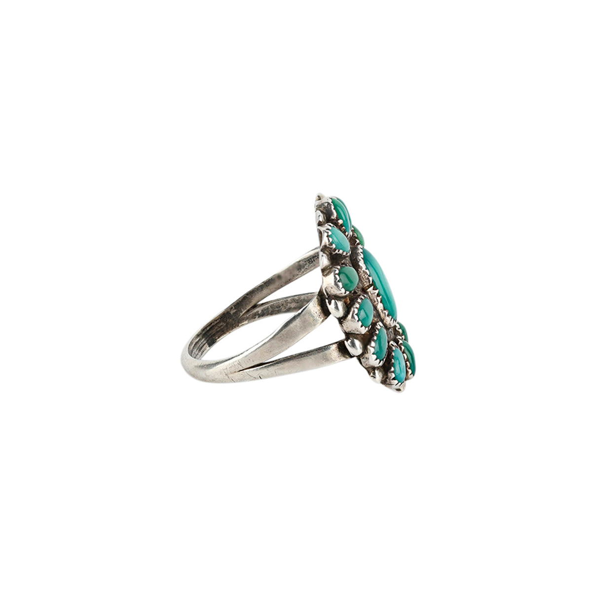 Vintage sterling silver ring with green turquoise and halo setting.