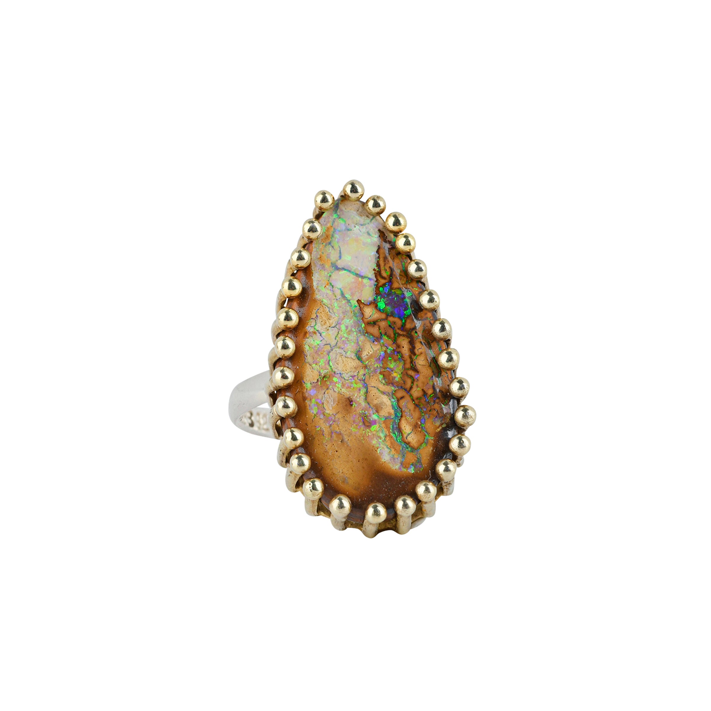 A Mixed Metal Ring of a stunning, teardrop Opal set in 14k Gold Plate prongs on a Sterling Silver band