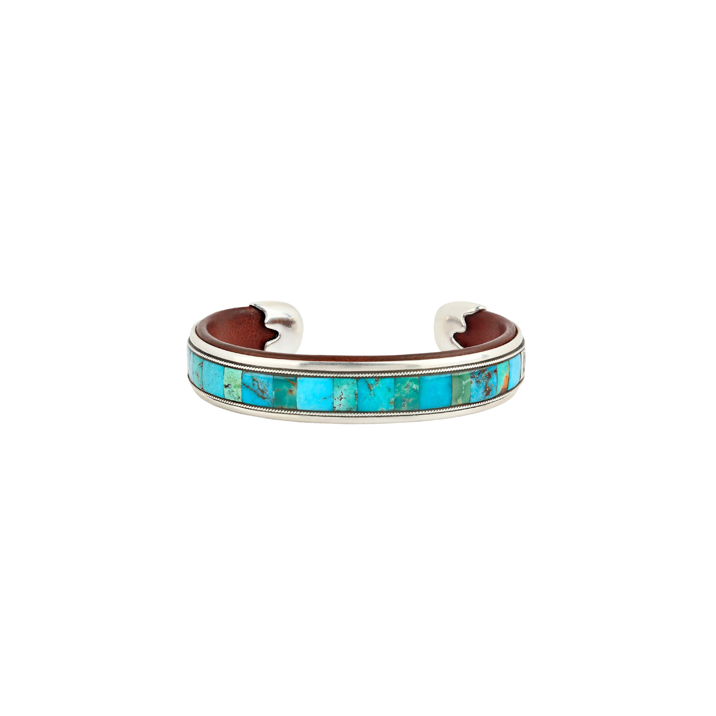 Turquoise mixed stones and sterling silver cuff with leather interior. 