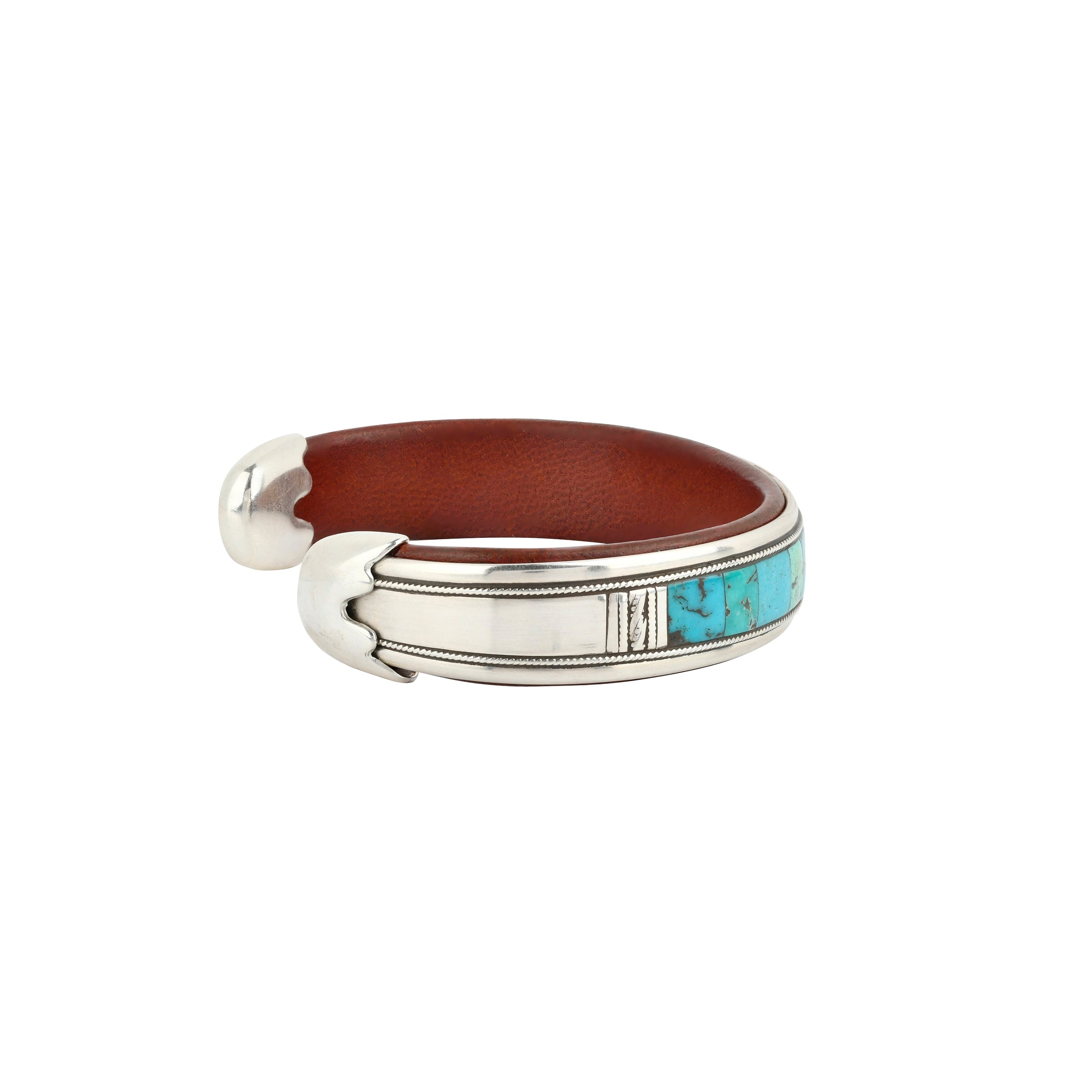 Turquoise mixed stones and sterling silver  end caps and silver accents on this cuff with leather interior. 