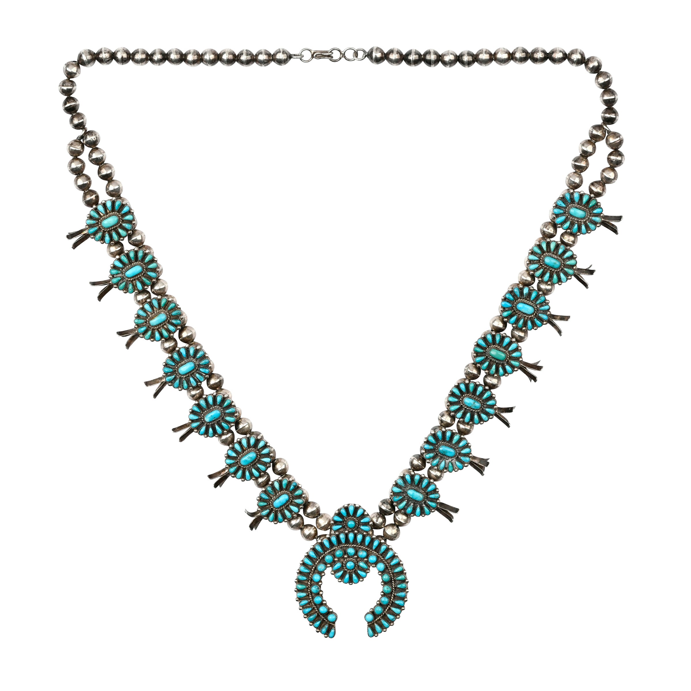 Vintage Zuni necklace features natural turquoise stones set in sterling silver