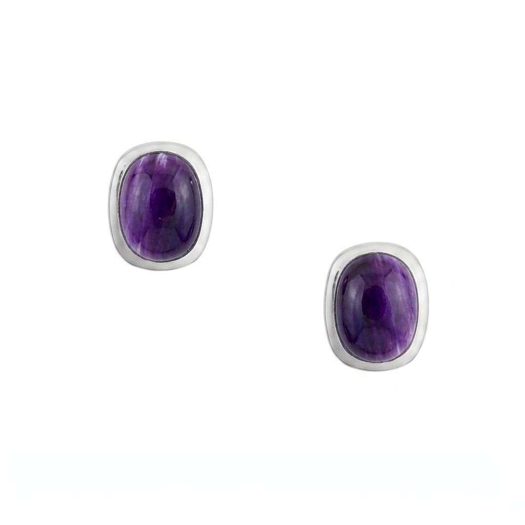 A pair of sterling silver stud earrings with rounded rectangular purple spiny oyster shell cabochons and comfort earring backs.