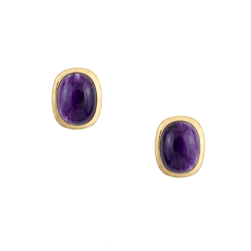 A pair of sterling silver and gold plated stud earrings with rounded rectangular purple spiny oyster shell cabochons and comfort earring backs.