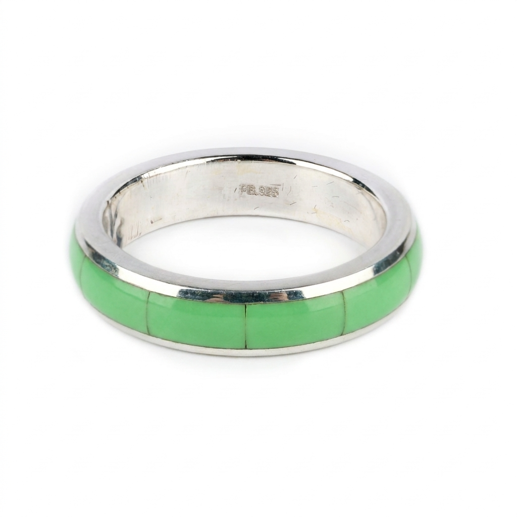 A sterling silver ring with gaspeite stone inlay.