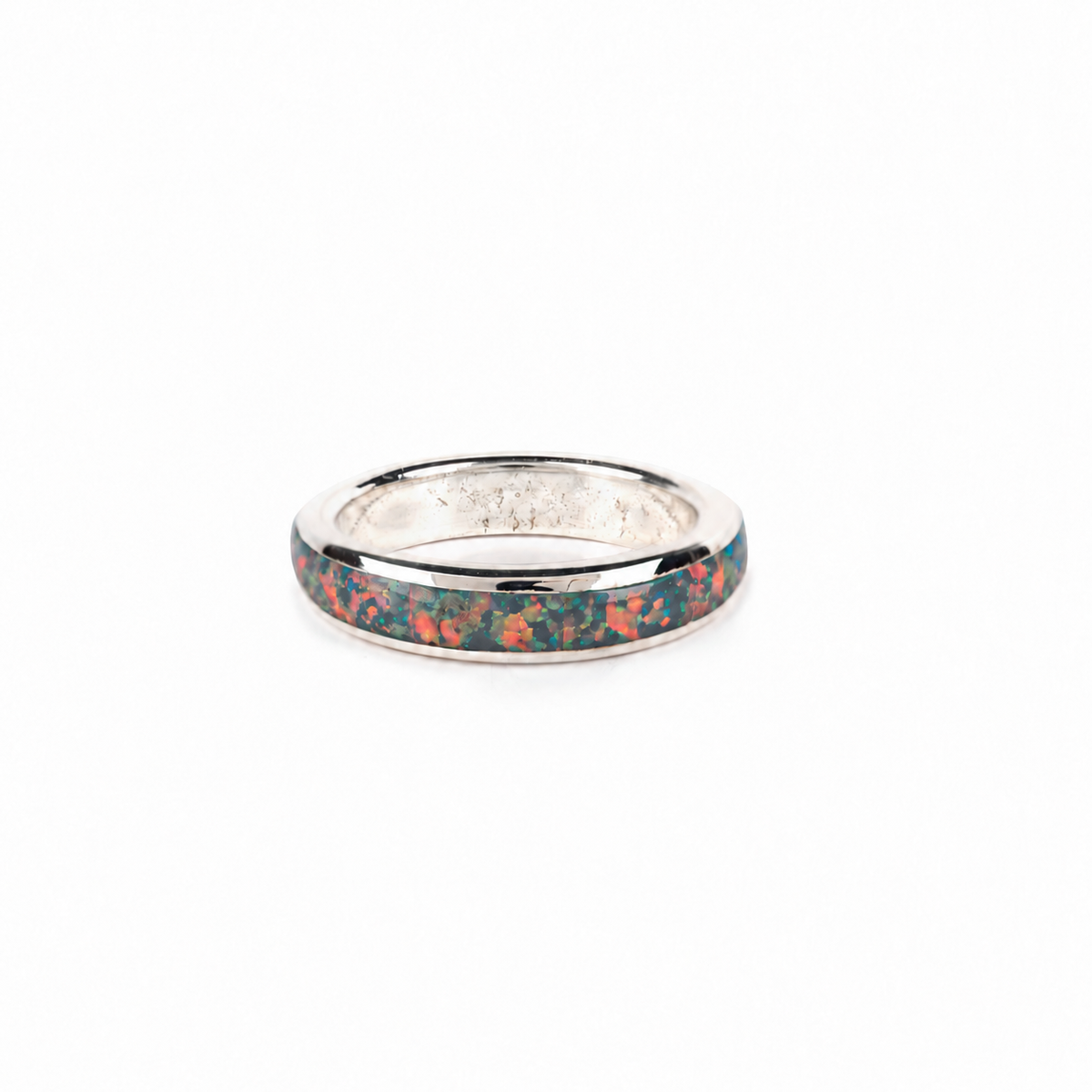 A sterling silver ring with a dark opal inlay.