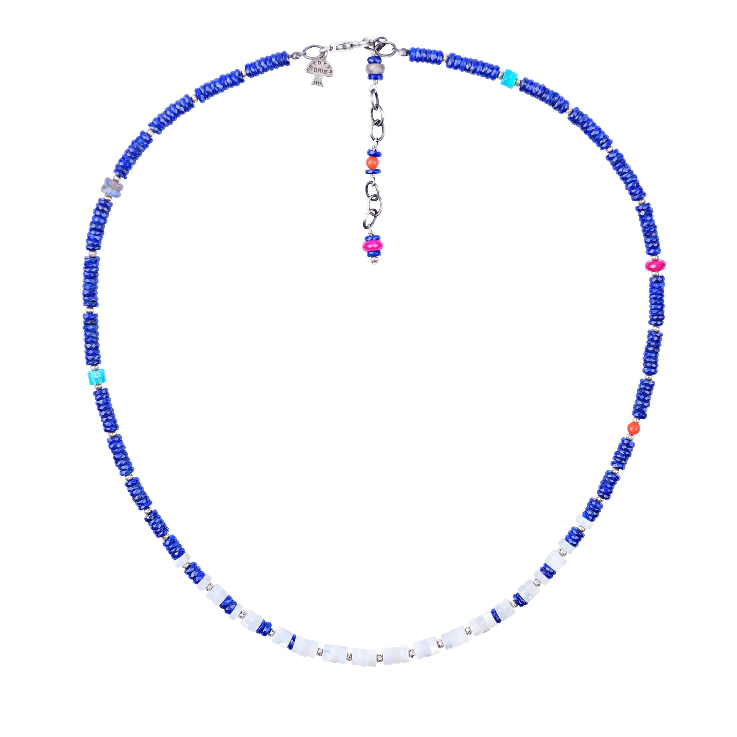 The Après Ski Necklace is a Peyote Bird Original. Featuring sterling silver, lapis, blue turquoise, mother of pearl, ruby, red coral, and labradorite. Made in USA.