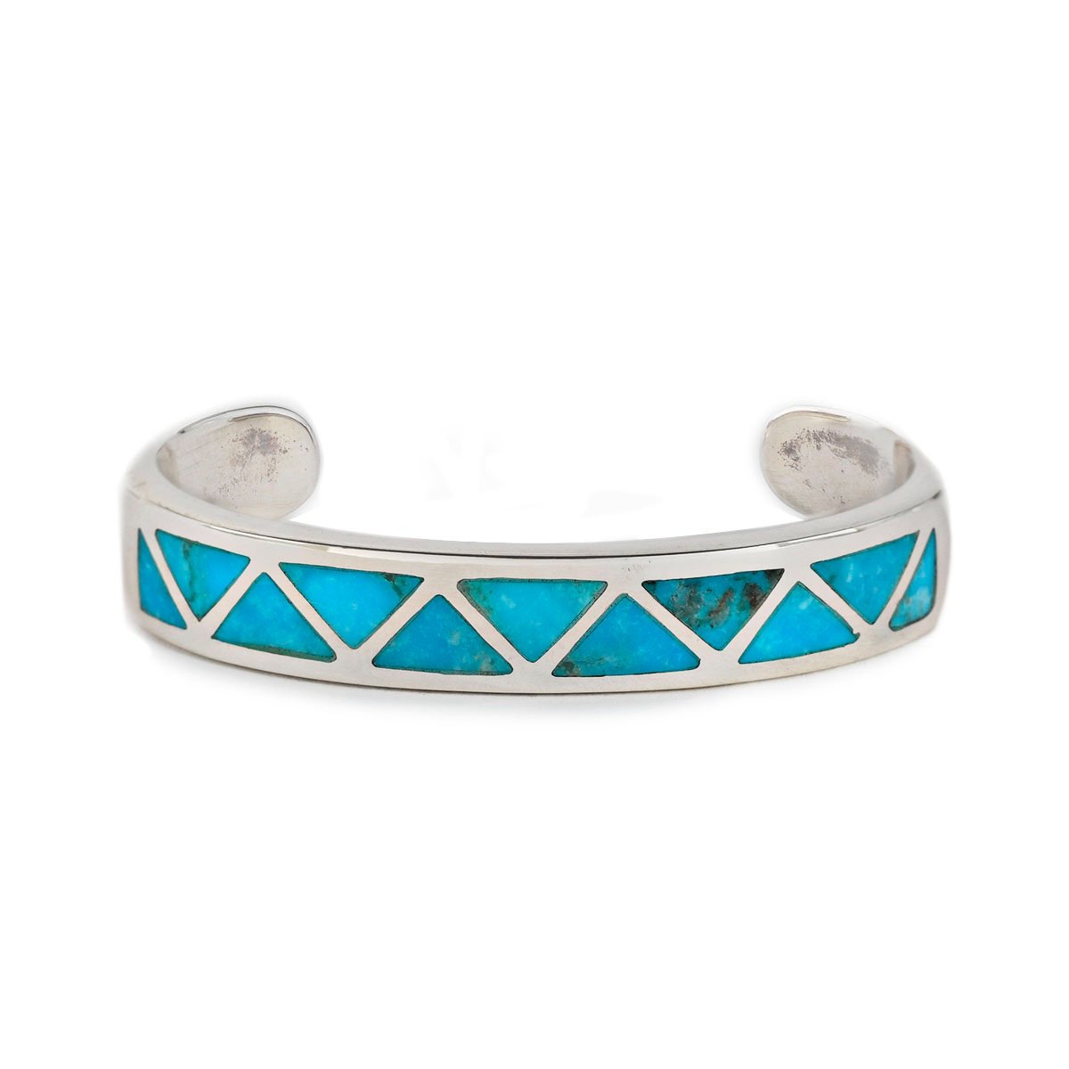 The vintage inspired Arrowhead cuff from our Bird and Arrow line that features sterling silver with blue turquoise stone inlay.  
