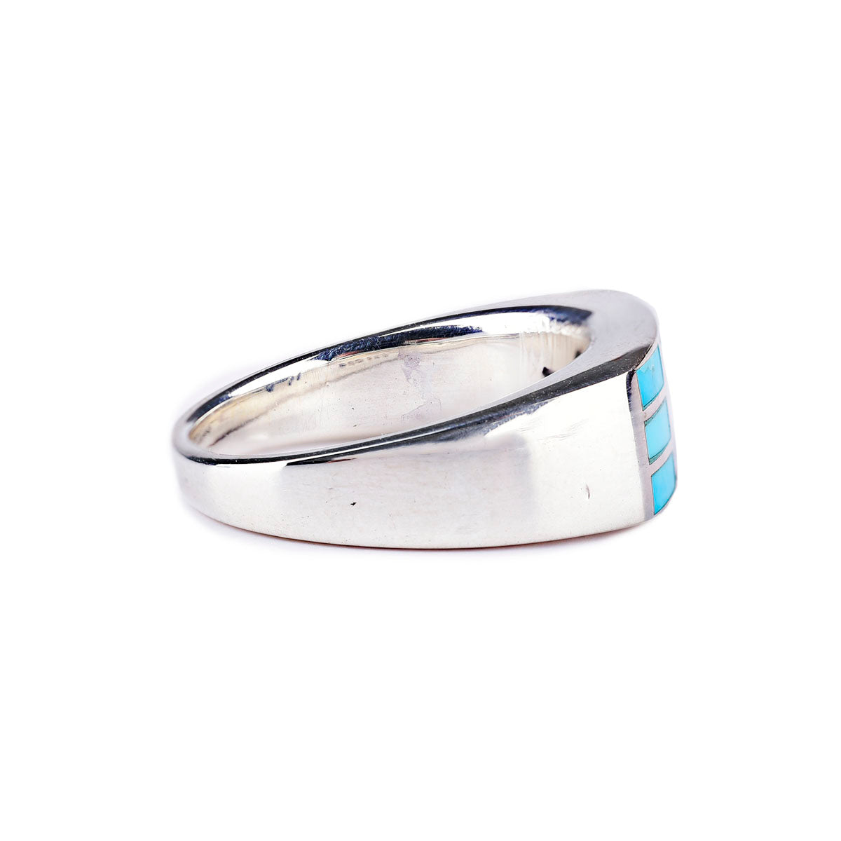 A sterling silver ring with geometric rectangular blue turquoise stone inlays.