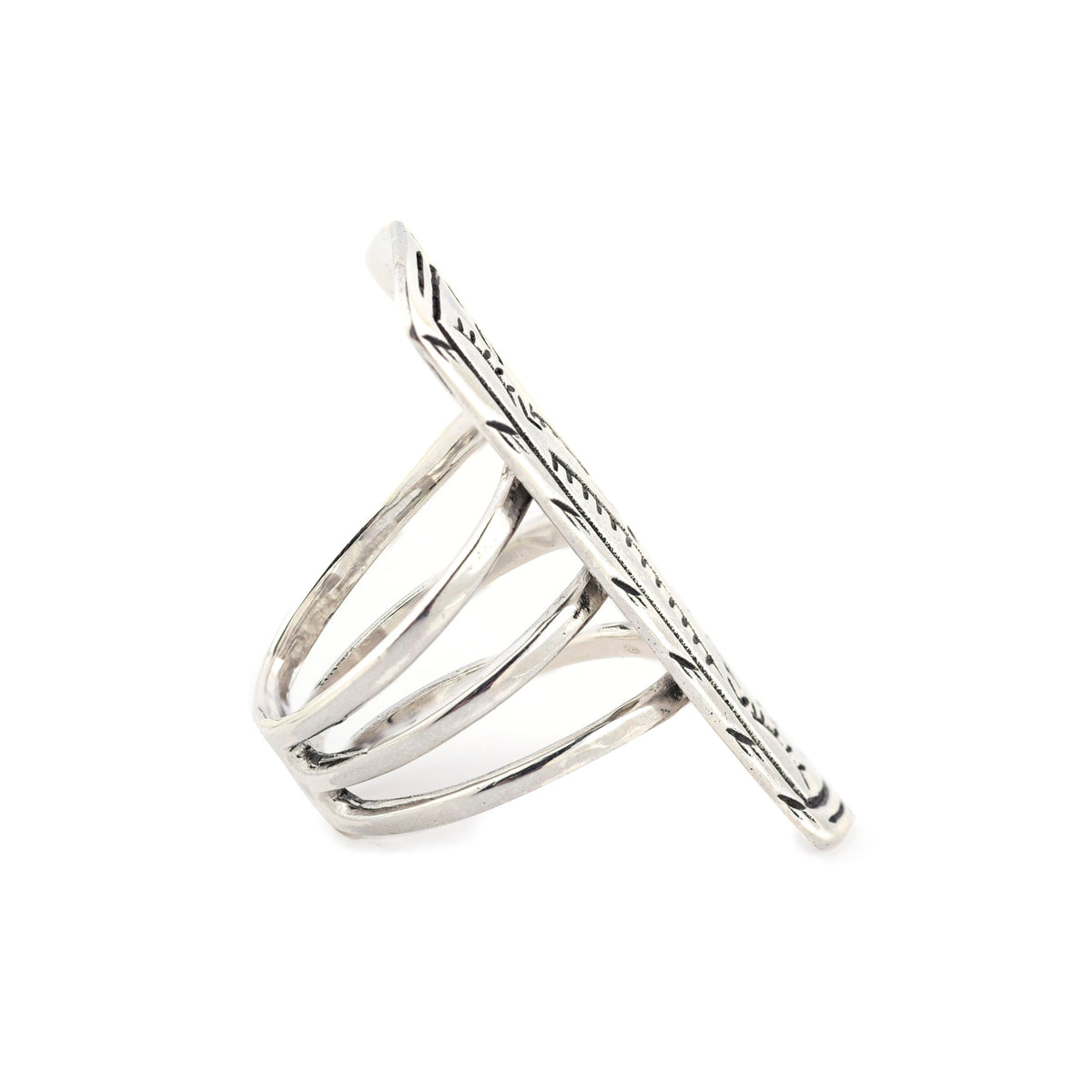 A sterling silver shield ring with a geometric floral pattern, featuring a split shank band design.