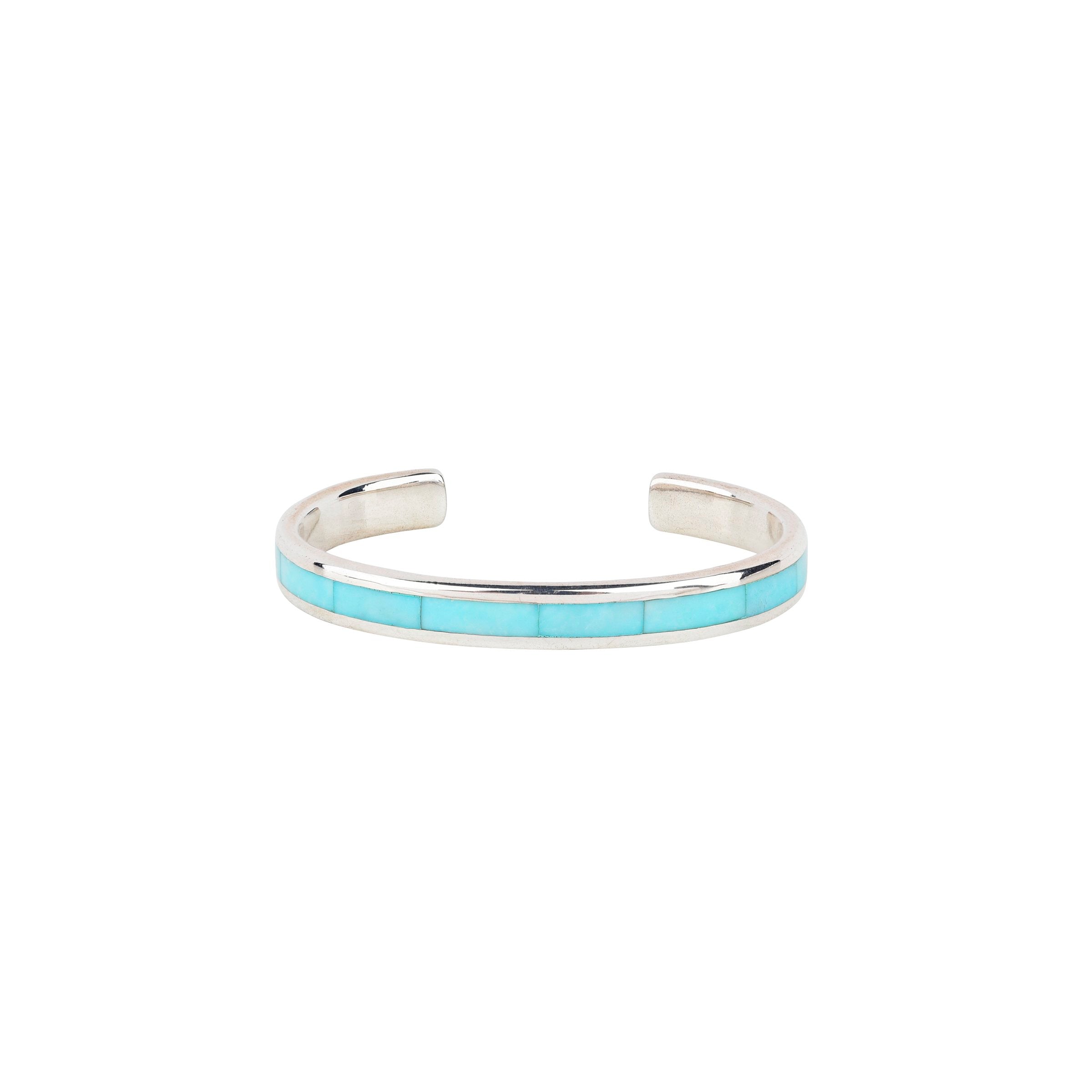 The vintage inspired Trail cuff from our Bird and Arrow line that features sterling silver with blue turquoise stone inlay.  
