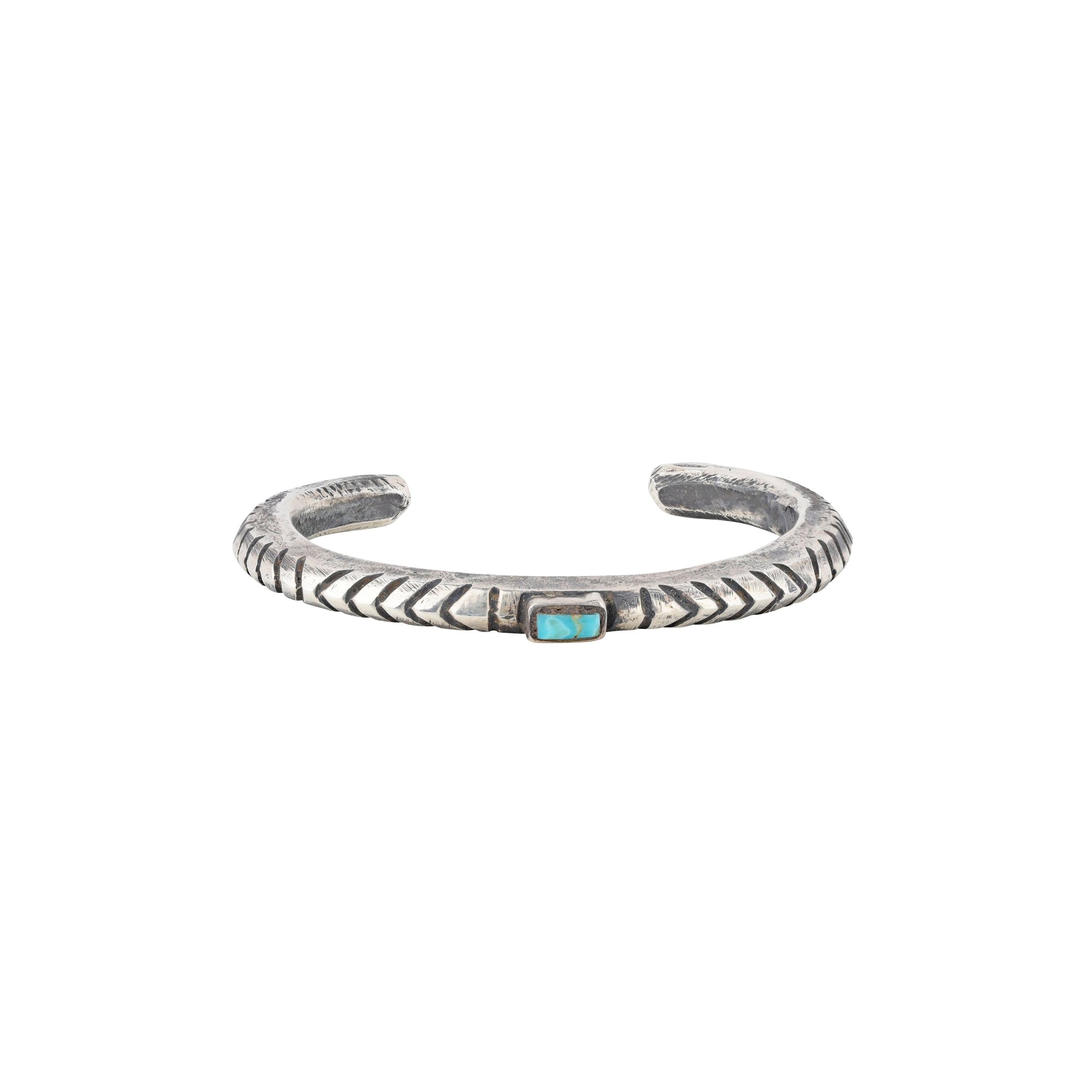 The Jock Favour Ridge Cuff features rugged Ingot Coin Silver and a rough but stunning center piece of Blue Turquoise. This cuff is pure western style.
