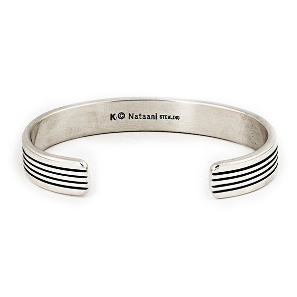 A sterling silver striped cuff from native artisan Karl Kee Nataani. Made in USA.