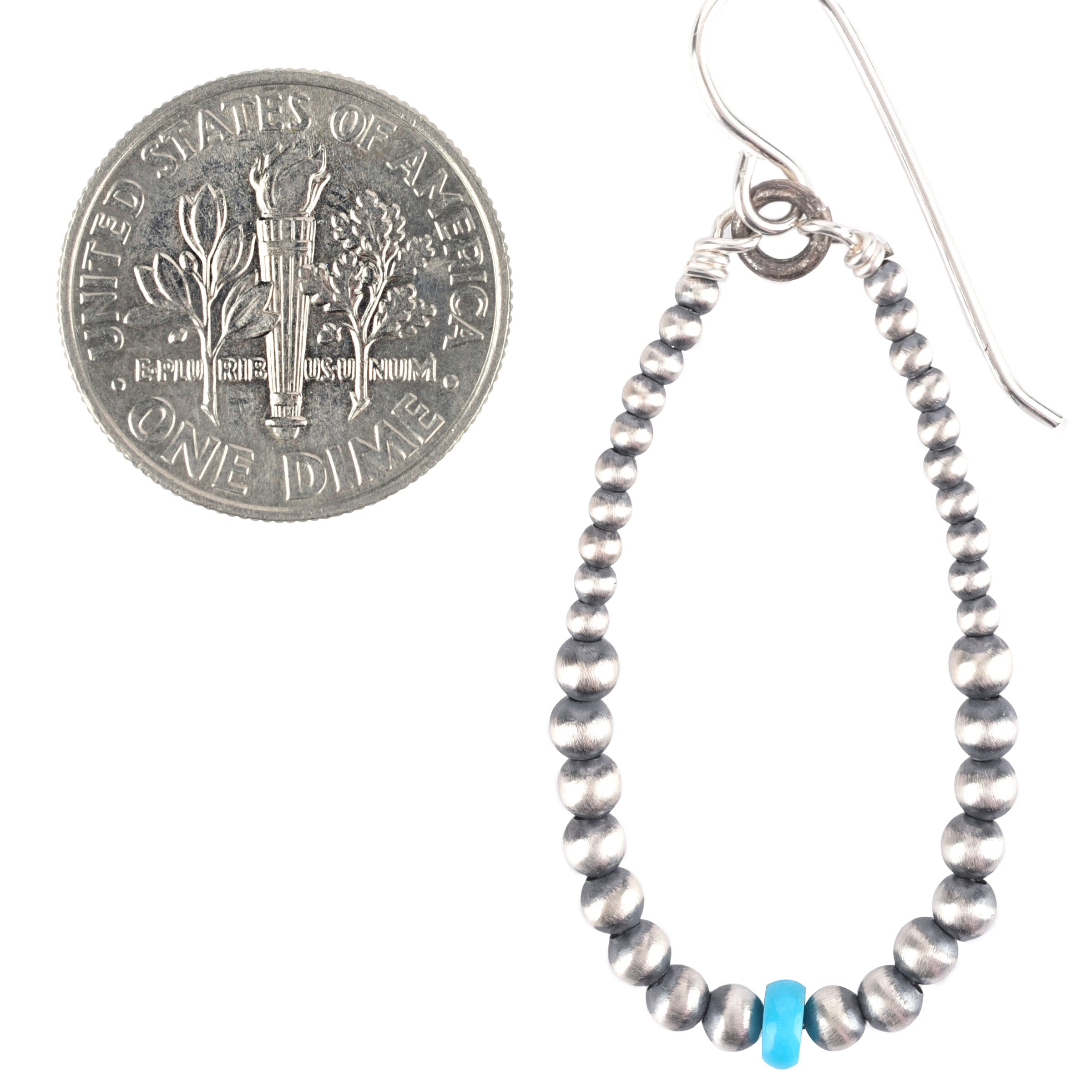 Sterling silver and blue turquoise dangle hoop earrings.