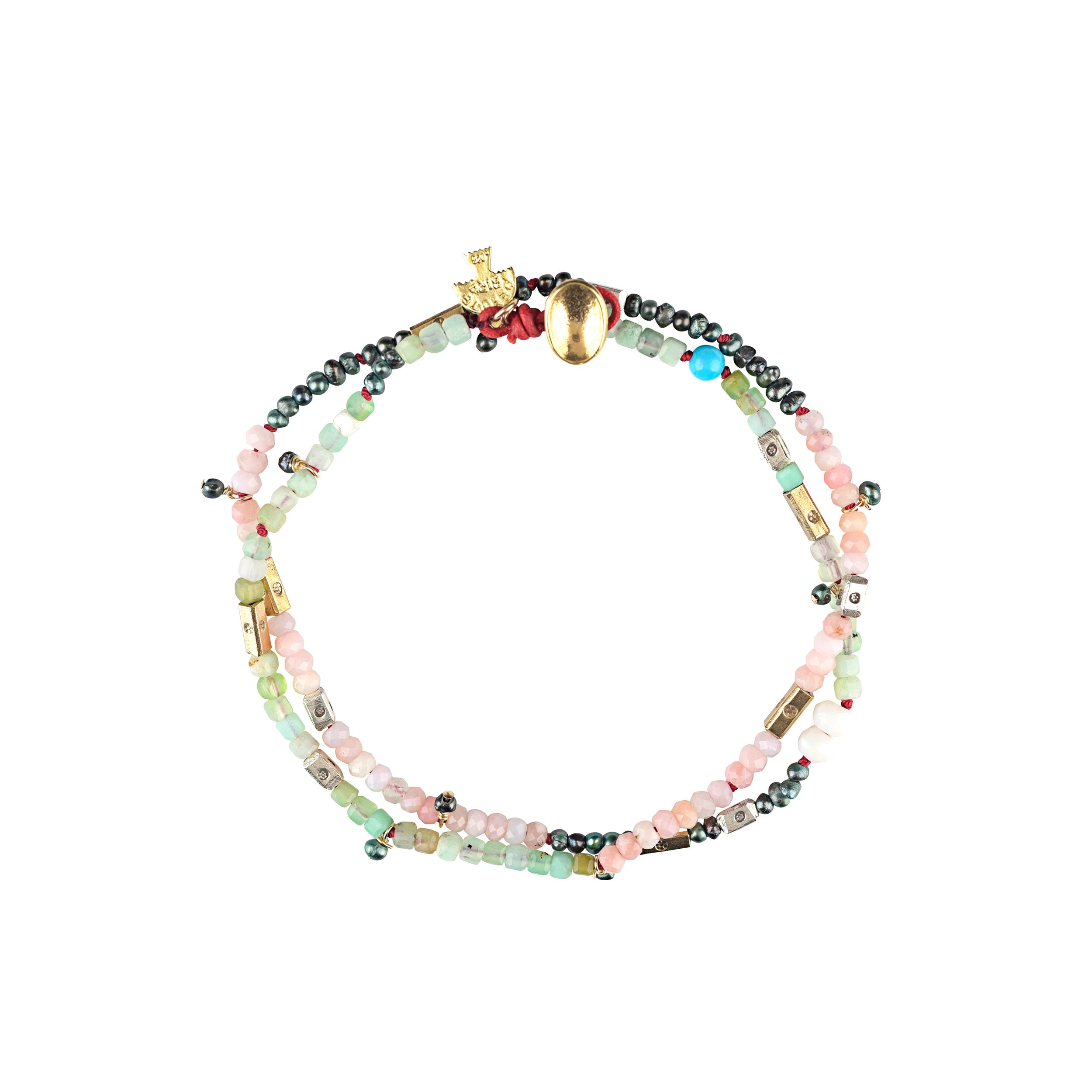 A beaded wrap bracelet strung with Turquoise, Pink Opal, Freshwater Pearl, Chrysoprase, Peruvian Opal, 14k Gold-fill, and Sterling Silver.