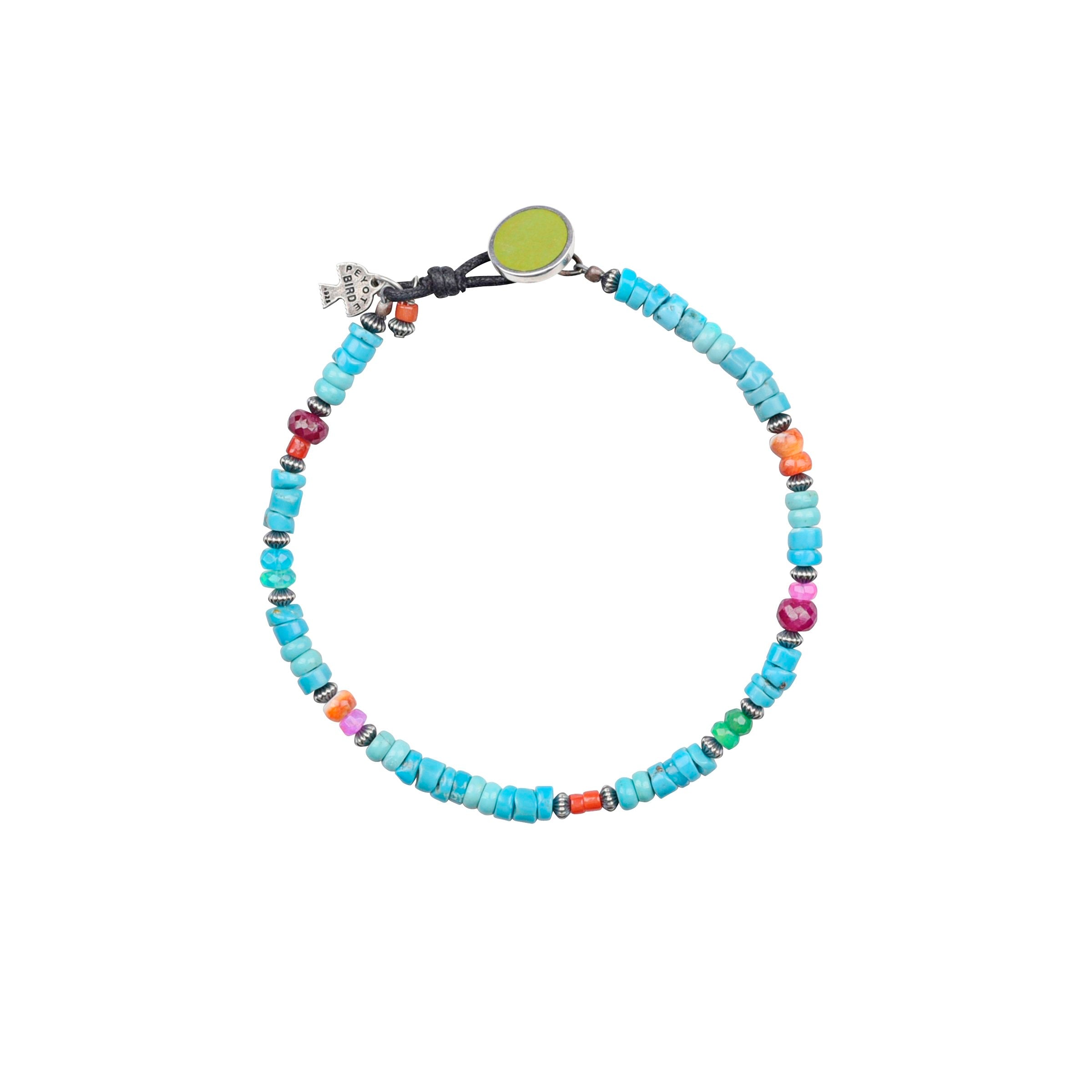 A colorful bracelet featuring blue & green turquoise, orange spiny oyster shell, red coral, pink & blue opal, with a sterling silver clasp and a green turquoise bead accent.