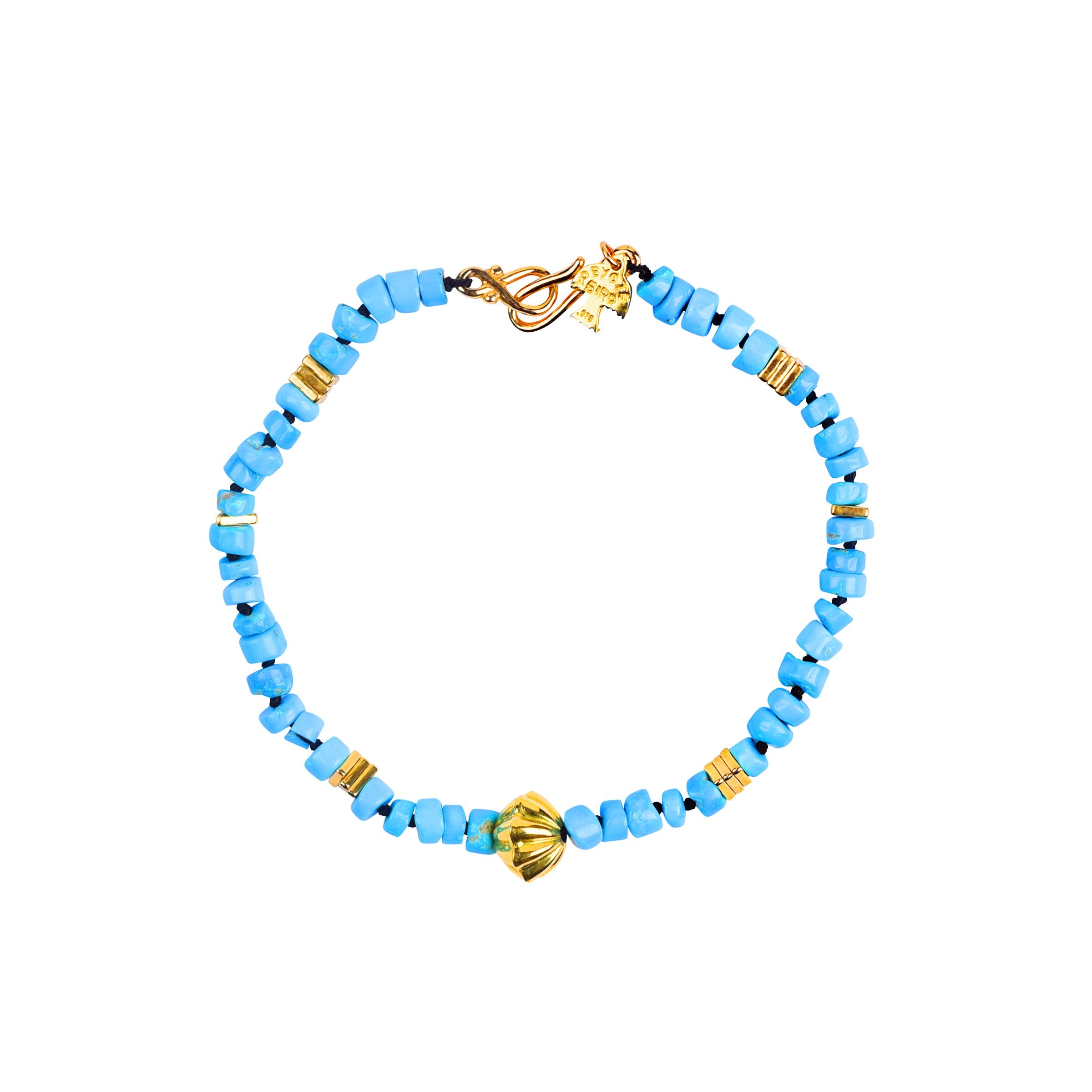 18 carat gold and blue turquoise bracelet with 18 carat gold shell-like bead. 