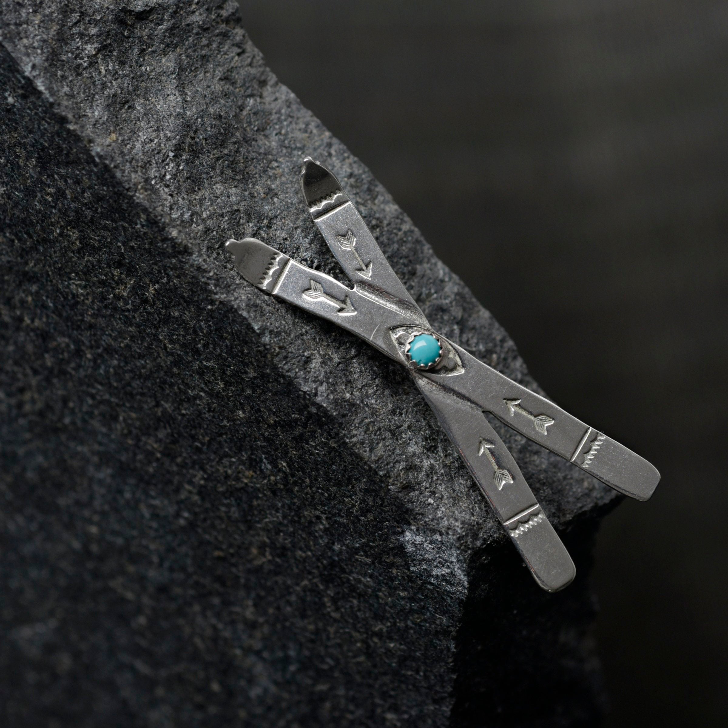 Joe Eby sterling silver skis pin with blue turquoise stone.