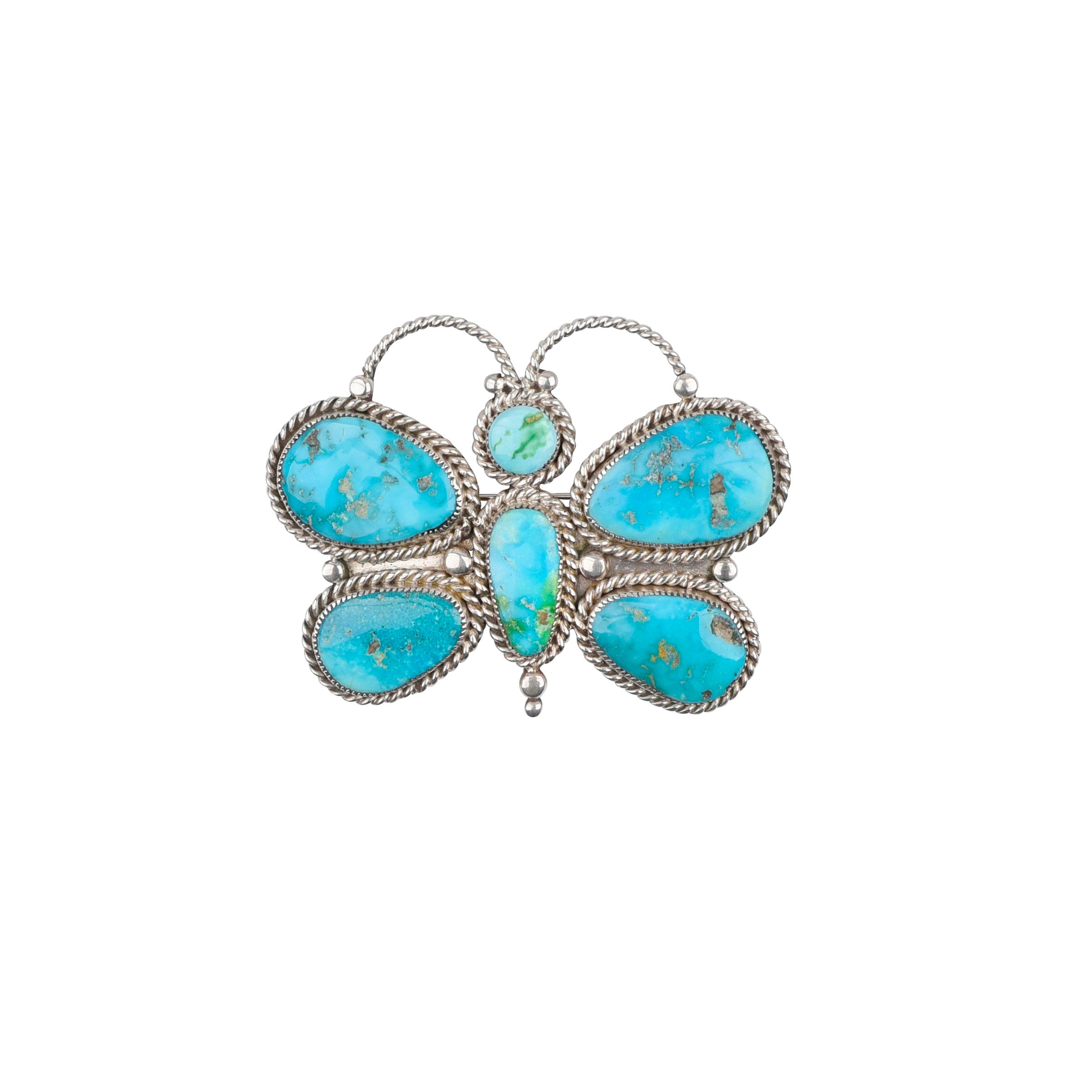 Sterling silver butterfly pin with vivid blue turquoise-whimsical Western charm with delicate detail and a playful, handcrafted spirit. 